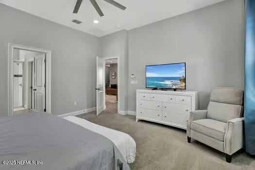 carpeted bedroom featuring visible vents, baseboards, and a ceiling fan