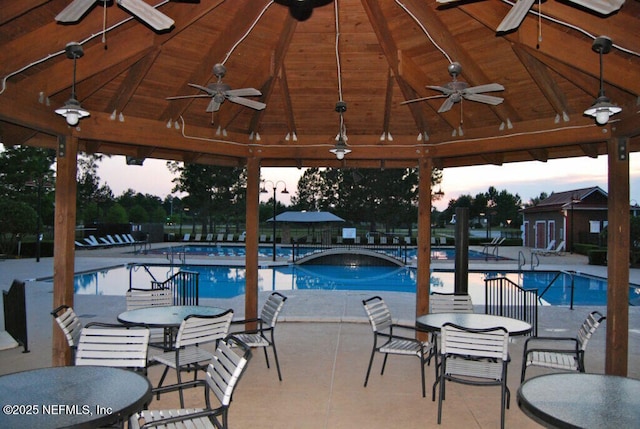 community pool featuring a gazebo and a patio