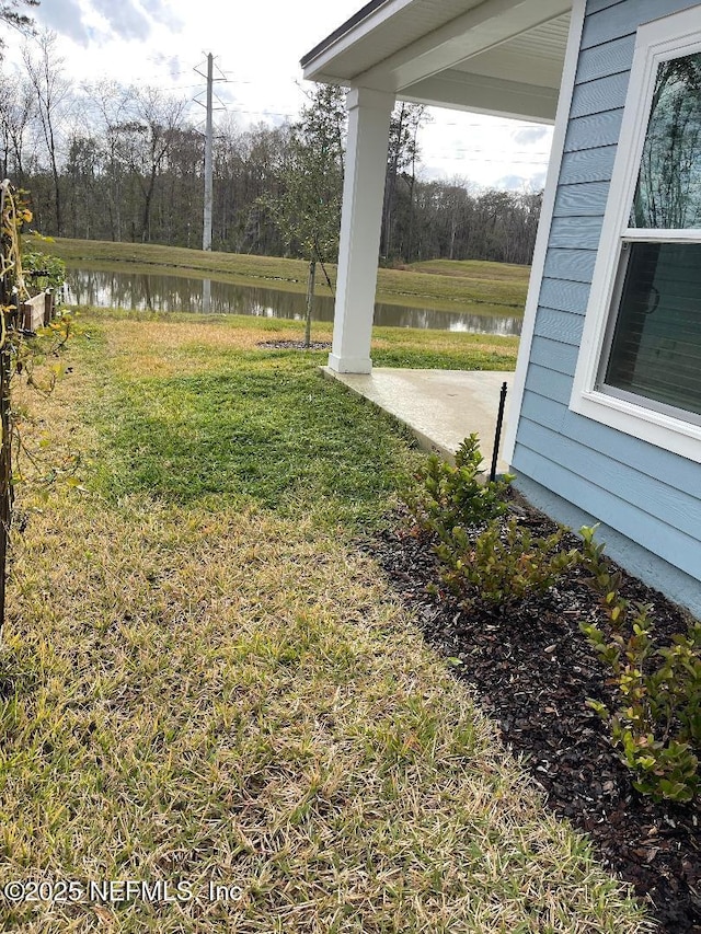 view of yard with a water view