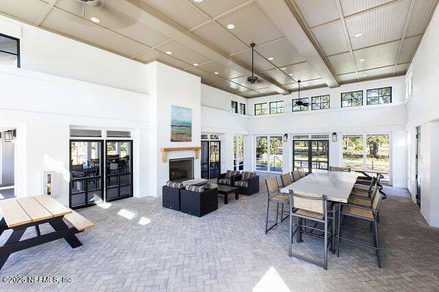 sunroom featuring a fireplace