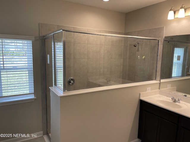 bathroom with vanity and a shower stall