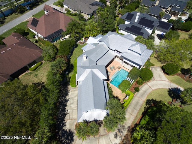 birds eye view of property with a residential view
