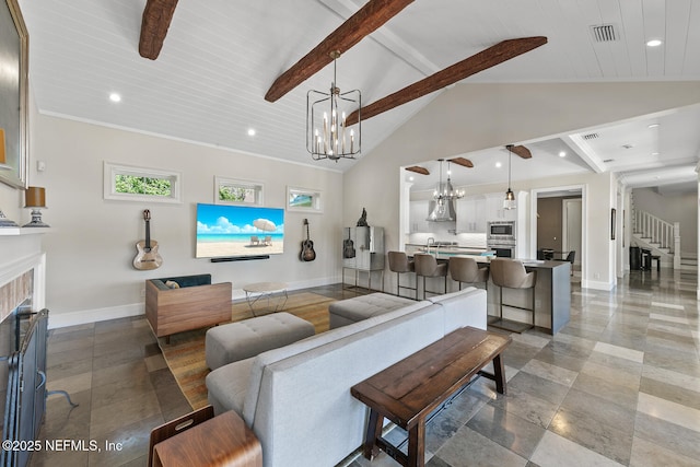 living area with beam ceiling, visible vents, a fireplace, and baseboards