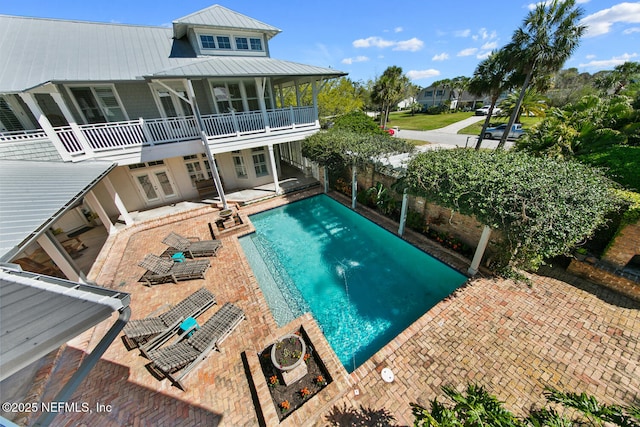 view of pool featuring french doors, a fenced in pool, a fenced backyard, and a patio area