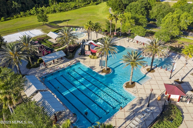 community pool featuring a patio area