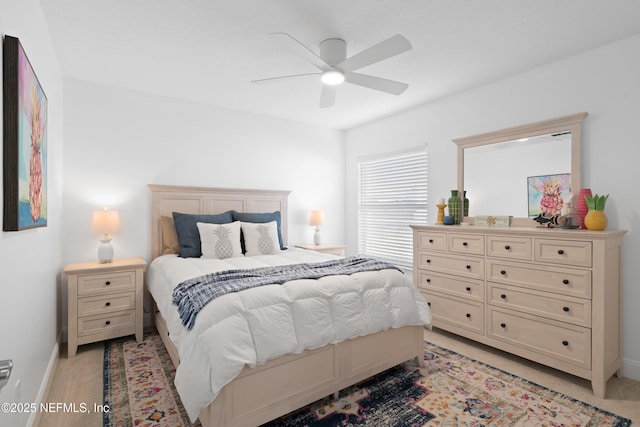 bedroom with baseboards and a ceiling fan