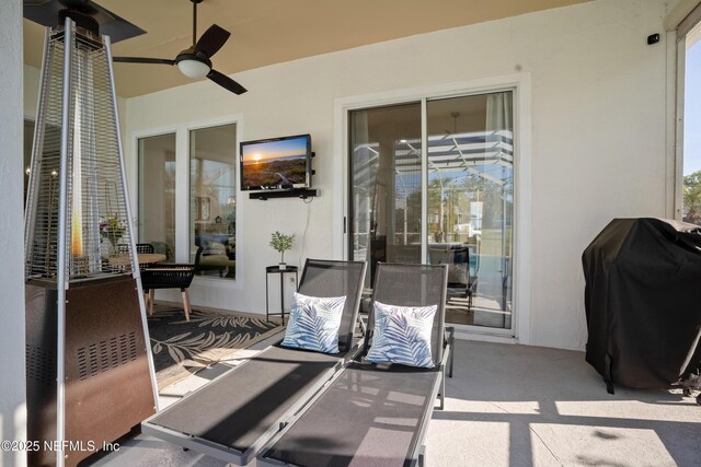 view of patio featuring grilling area and ceiling fan