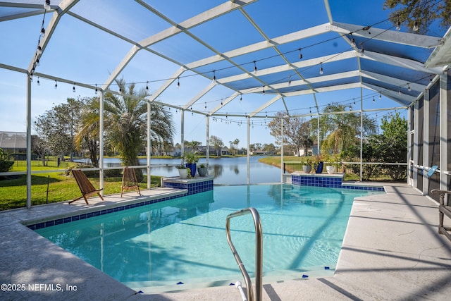 outdoor pool featuring glass enclosure, a patio area, and a water view