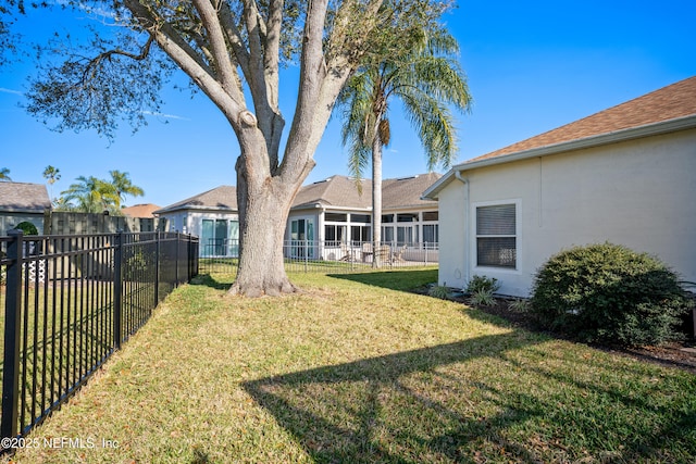 view of yard with a fenced backyard