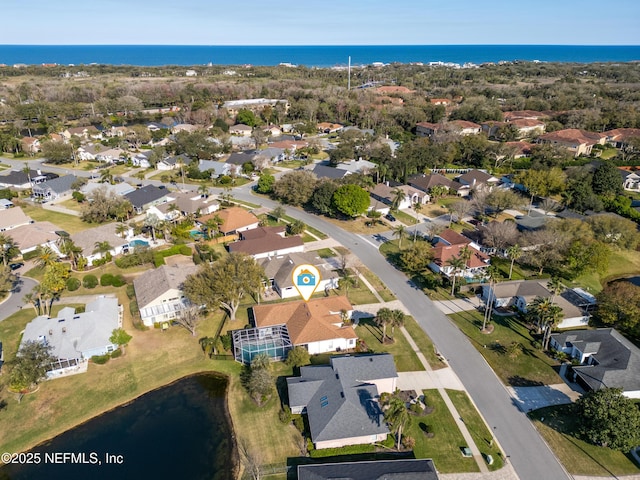 bird's eye view featuring a residential view and a water view