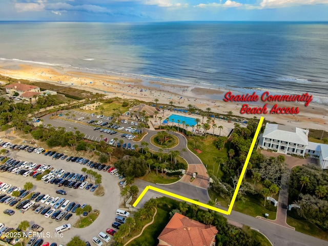 aerial view with a view of the beach and a water view