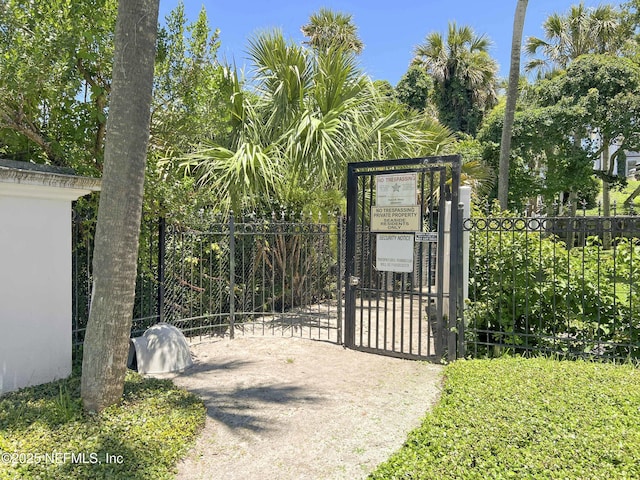 view of gate with fence