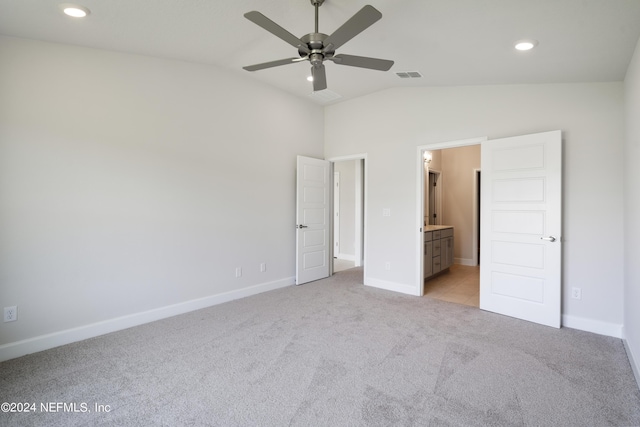 unfurnished bedroom with recessed lighting, light colored carpet, visible vents, baseboards, and vaulted ceiling