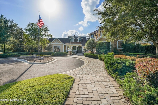 view of front of house with decorative driveway