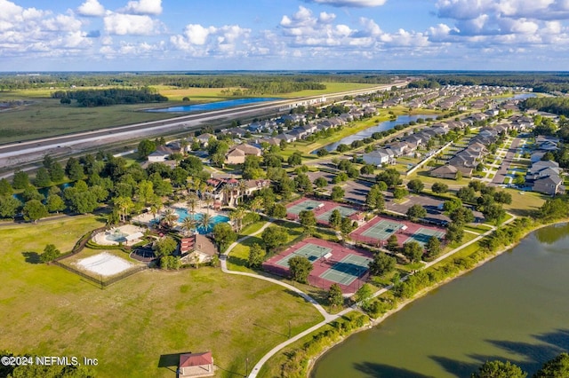 birds eye view of property with a residential view and a water view