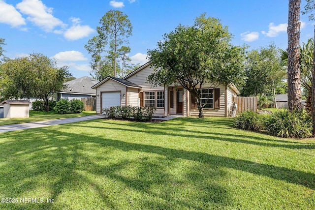 view of front of house featuring driveway, a front lawn, an attached garage, and fence