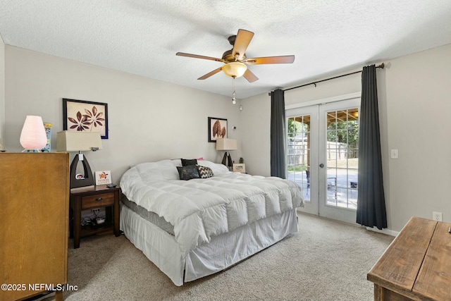 bedroom with access to exterior, a textured ceiling, french doors, light colored carpet, and ceiling fan