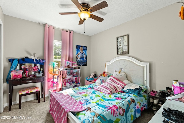 carpeted bedroom with ceiling fan and a textured ceiling