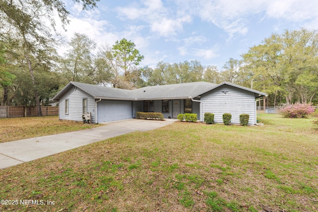 ranch-style home featuring a front yard, concrete driveway, fence, and a garage