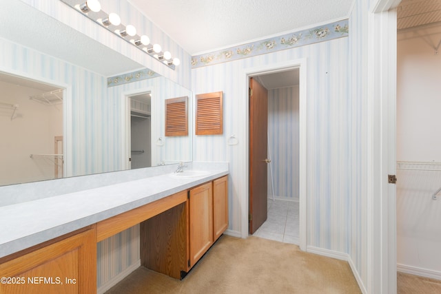 full bathroom featuring a spacious closet and wallpapered walls