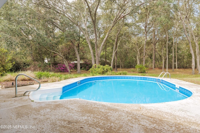 pool featuring a patio area