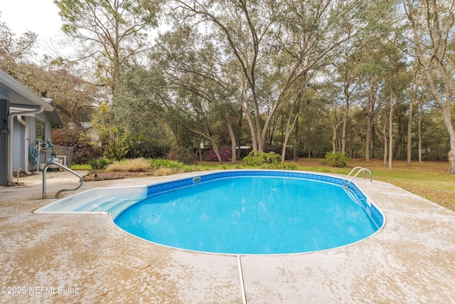 outdoor pool with a patio