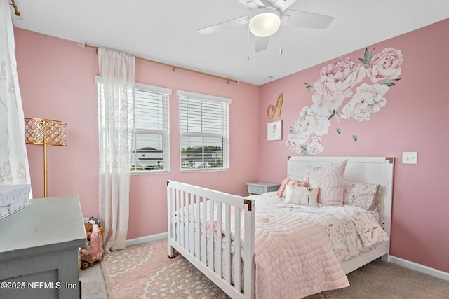 carpeted bedroom featuring baseboards and ceiling fan