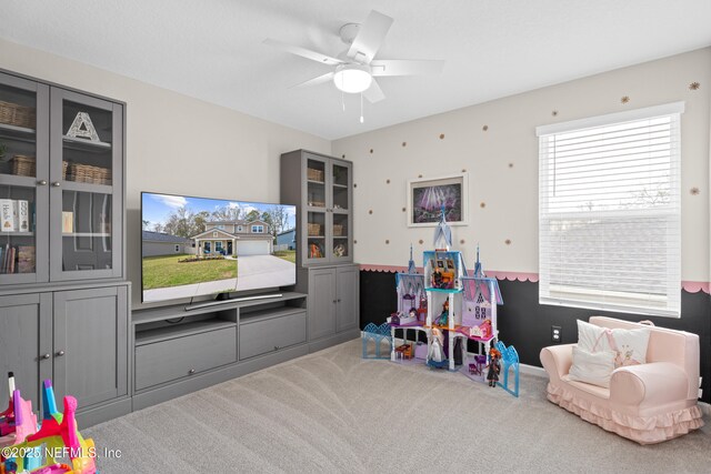 playroom with carpet and ceiling fan