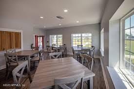 dining room with visible vents, recessed lighting, dark wood-style flooring, and a wealth of natural light