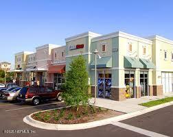 view of property with uncovered parking