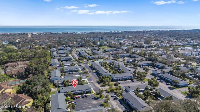 birds eye view of property with a water view and a residential view