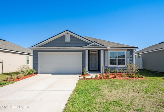 ranch-style house featuring driveway, an attached garage, and a front lawn