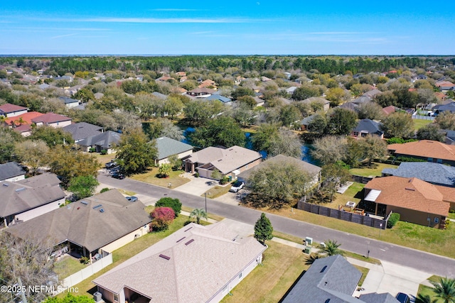 birds eye view of property with a residential view