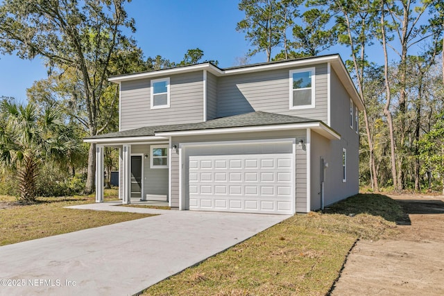 view of front facade with driveway, an attached garage, and a shingled roof