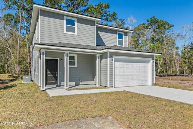 traditional home featuring a front yard, concrete driveway, central AC unit, and a porch