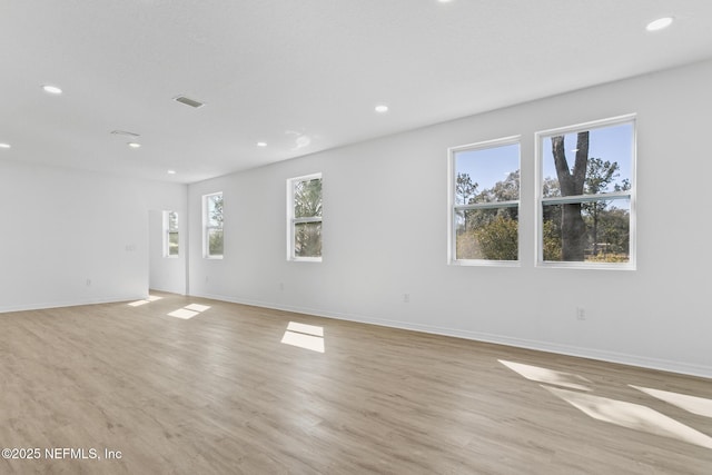 interior space with recessed lighting, baseboards, and light wood-style floors