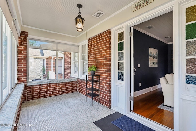 unfurnished sunroom featuring visible vents