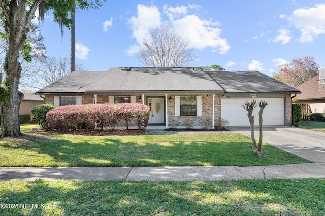 single story home featuring a garage, brick siding, concrete driveway, and a front lawn