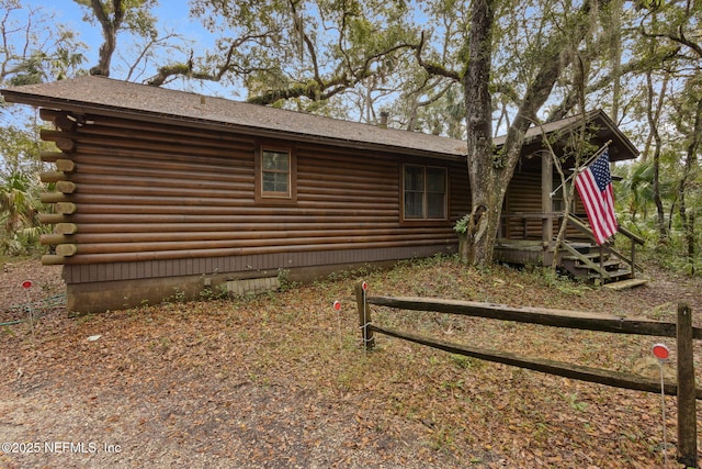 back of house with log exterior