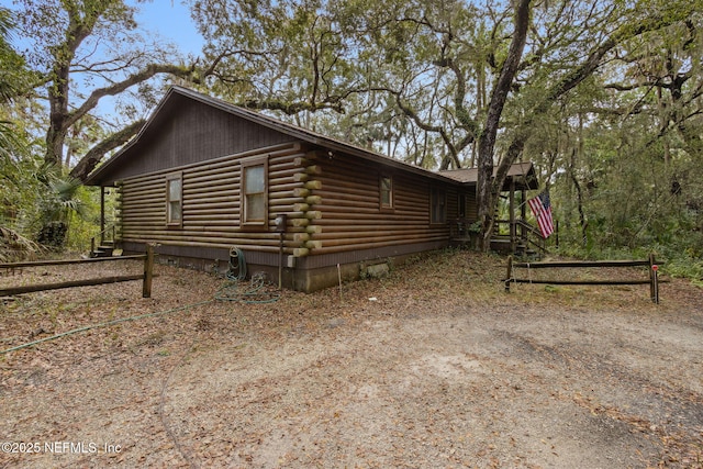 view of home's exterior featuring log exterior