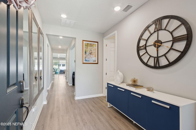 interior space featuring recessed lighting, light wood-type flooring, visible vents, and baseboards