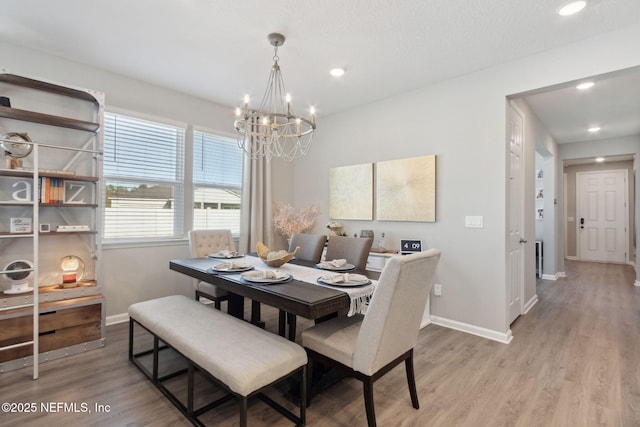 dining area with light wood-type flooring, baseboards, and recessed lighting