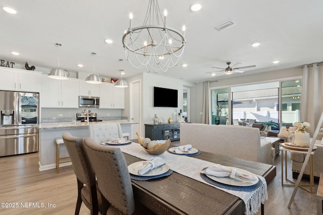 dining space with recessed lighting, visible vents, ceiling fan, and light wood-style flooring