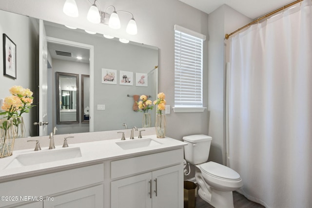 full bath with plenty of natural light, visible vents, and a sink