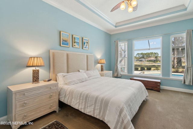 861998 N Hampton Club Way, Fernandina Beach, FL 32034 - carpeted bedroom featuring a ceiling fan, a tray ceiling, baseboards, and crown molding