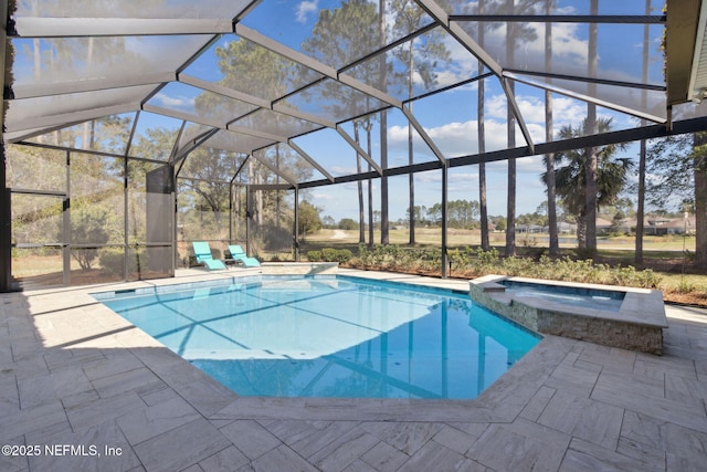 861998 N Hampton Club Way, Fernandina Beach, FL 32034 - view of swimming pool featuring glass enclosure, a pool with connected hot tub, and a patio