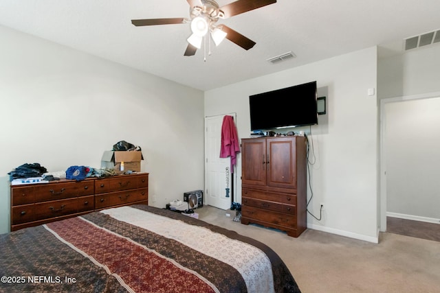 bedroom featuring visible vents, light carpet, baseboards, and a ceiling fan