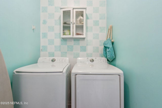 laundry room with washer and dryer and laundry area