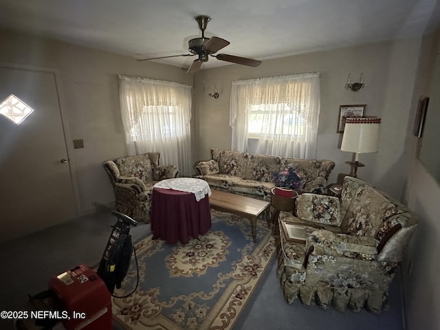 living area with ceiling fan