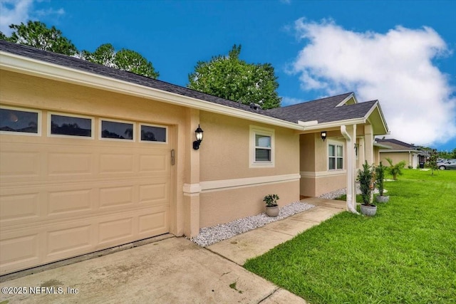 exterior space with a shingled roof, a lawn, a garage, and stucco siding